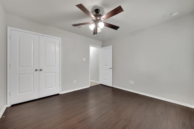 1209 Evers Dr, Mckinney, TX 75071 - unfurnished bedroom with baseboards, dark wood finished floors, a closet, and a ceiling fan