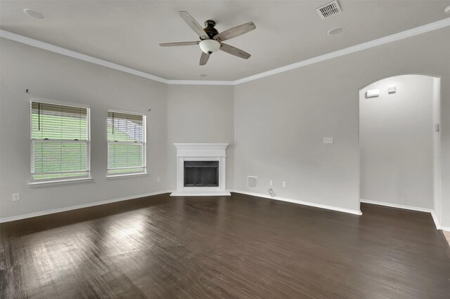1209 Evers Dr, Mckinney, TX 75071 - unfurnished living room with a ceiling fan, arched walkways, dark wood-type flooring, a fireplace with raised hearth, and baseboards