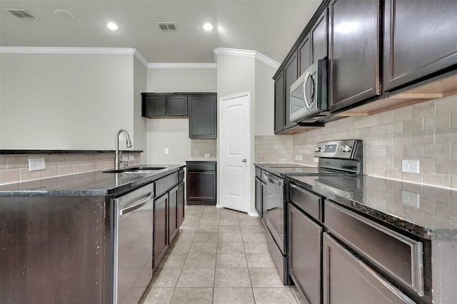 1209 Evers Dr, Mckinney, TX 75071 - kitchen with appliances with stainless steel finishes, a sink, crown molding, dark stone counters, and light tile patterned floors