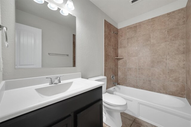 1209 Evers Dr, Mckinney, TX 75071 - full bath with a textured wall, toilet, vanity, shower / washtub combination, and tile patterned floors