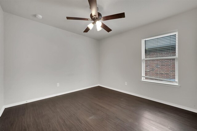 1209 Evers Dr, Mckinney, TX 75071 - unfurnished room with a ceiling fan, dark wood-style floors, baseboards, and a smoke detector