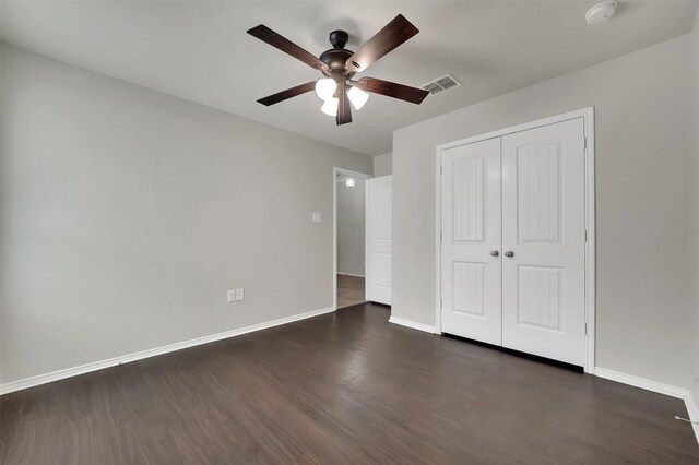 1209 Evers Dr, Mckinney, TX 75071 - unfurnished bedroom featuring dark wood-type flooring, baseboards, a closet, and a ceiling fan