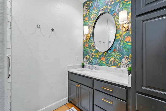99 Glen Abbey St, Abilene, TX 79606 - bathroom featuring vanity, wallpapered walls, baseboards, and tile patterned floors