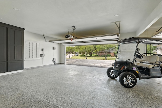 99 Glen Abbey St, Abilene, TX 79606 - garage featuring a garage door opener