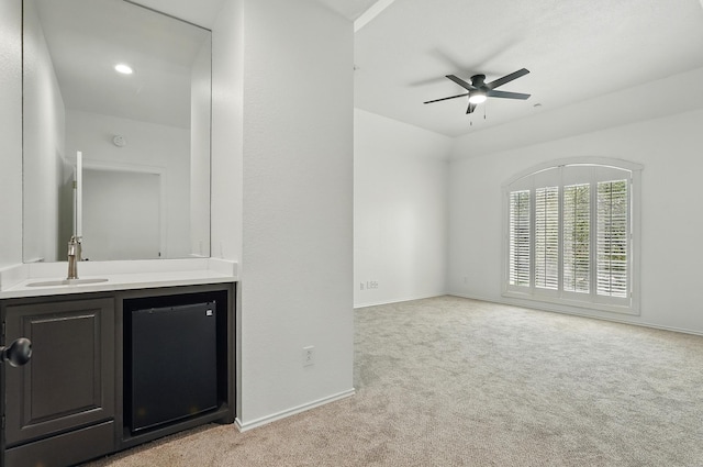 99 Glen Abbey St, Abilene, TX 79606 - unfurnished living room with light carpet, a ceiling fan, and baseboards