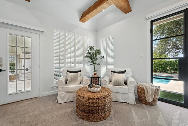 99 Glen Abbey St, Abilene, TX 79606 - living area featuring beam ceiling and carpet floors