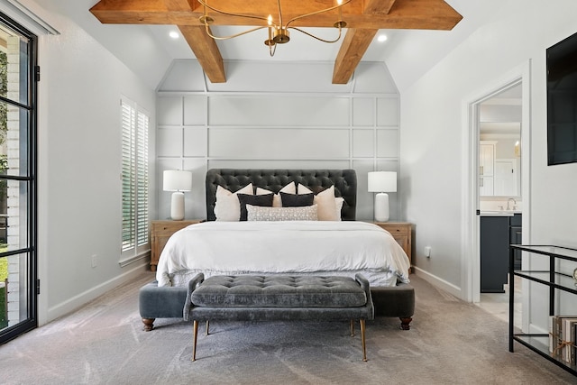 99 Glen Abbey St, Abilene, TX 79606 - bedroom featuring a chandelier, light carpet, baseboards, a sink, and ensuite bathroom