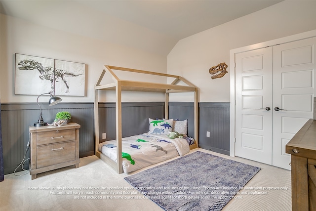 4809 Nomad Dr, Midlothian, TX 76065 - carpeted bedroom featuring a wainscoted wall, vaulted ceiling, and a closet