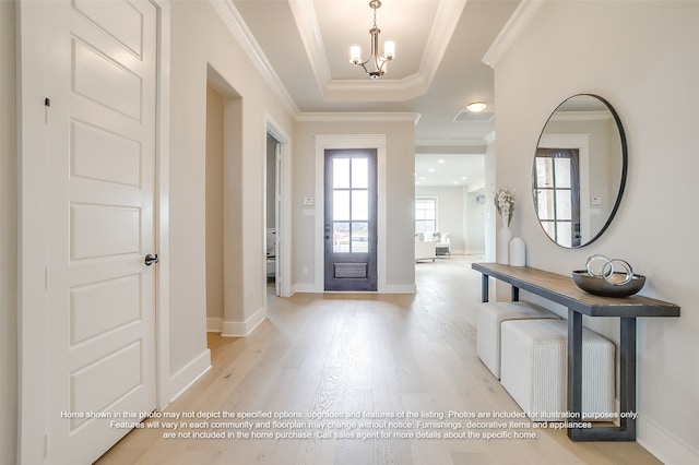 4809 Nomad Dr, Midlothian, TX 76065 - foyer featuring light wood-style floors, a chandelier, crown molding, baseboards, and a tray ceiling