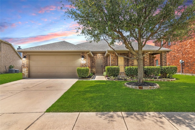 990 Lancashire Ln, Prosper, TX 75078 - view of front of house featuring a garage, driveway, a front yard, brick siding, and central AC unit