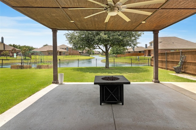 990 Lancashire Ln, Prosper, TX 75078 - view of patio featuring a fire pit, a water view, ceiling fan, and a residential view