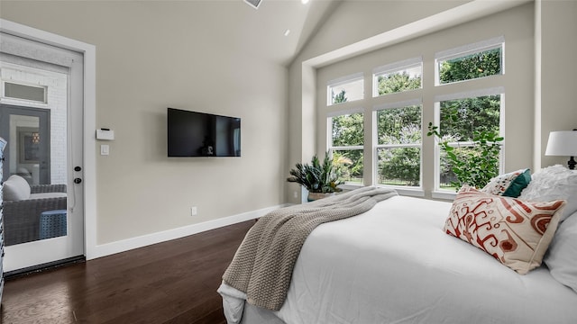 8162 Edgefield Ct, Frisco, TX 75035 - bedroom featuring dark wood-type flooring and a towering ceiling