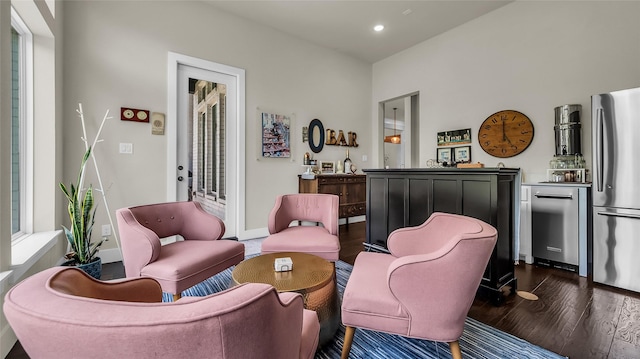 8162 Edgefield Ct, Frisco, TX 75035 - sitting room with dark wood-style flooring, recessed lighting, and a bar