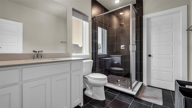 8162 Edgefield Ct, Frisco, TX 75035 - full bath with tile patterned floors, a shower stall, vanity, and recessed lighting