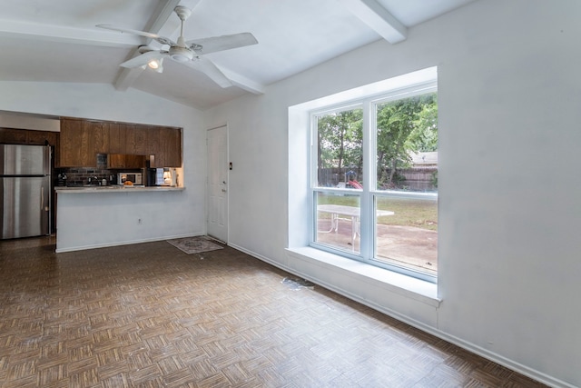 1001 N Ector Dr, Euless, TX 76039 - unfurnished living room featuring a ceiling fan and baseboards