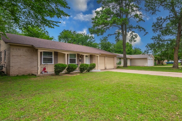 1001 N Ector Dr, Euless, TX 76039 - ranch-style home featuring a garage, driveway, a front yard, and brick siding