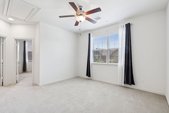 4682 Rhett Ln Unit A, Carrollton, TX 75010 - spare room with attic access, a ceiling fan, light colored carpet, and baseboards