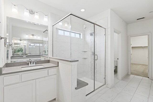 4682 Rhett Ln Unit A, Carrollton, TX 75010 - full bathroom with a stall shower, toilet, marble finish floors, vanity, and a spacious closet