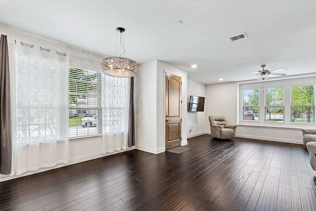 4682 Rhett Ln Unit A, Carrollton, TX 75010 - living area with dark wood-style flooring, plenty of natural light, baseboards, and recessed lighting