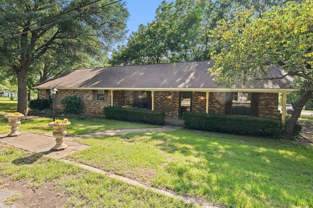891 Lazy Acres Cir, Pottsboro, TX 75076 - ranch-style house featuring a front lawn, brick siding, and a shingled roof