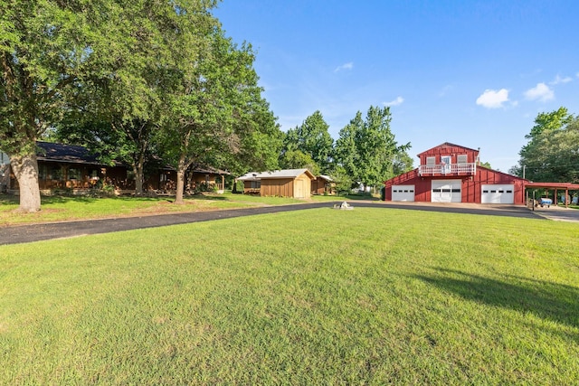 891 Lazy Acres Cir, Pottsboro, TX 75076 - view of grassy yard featuring driveway and a garage