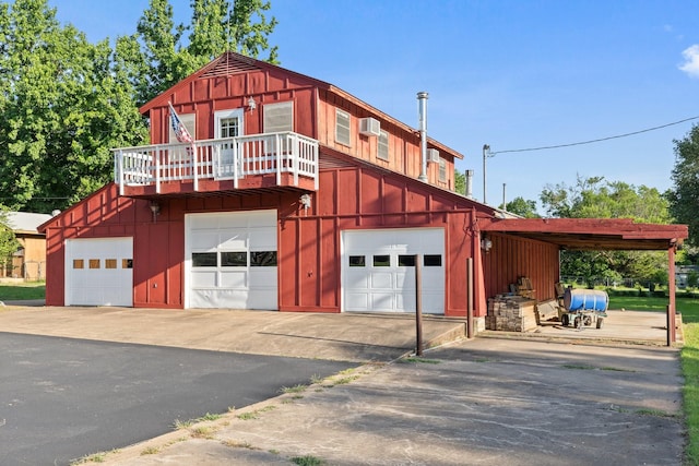 891 Lazy Acres Cir, Pottsboro, TX 75076 - view of front facade with board and batten siding, a balcony, and a wall mounted AC