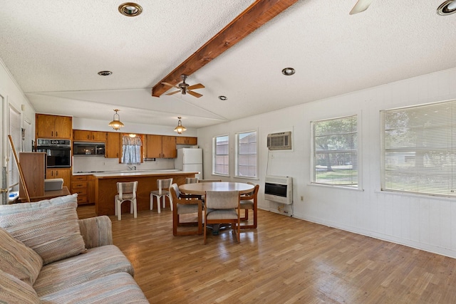 891 Lazy Acres Cir, Pottsboro, TX 75076 - living area featuring heating unit, ceiling fan, light wood-style floors, a textured ceiling, and an AC wall unit