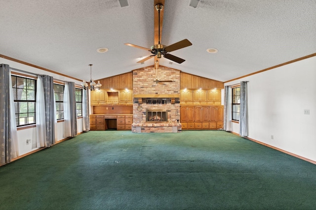 891 Lazy Acres Cir, Pottsboro, TX 75076 - unfurnished living room featuring lofted ceiling, crown molding, ceiling fan, a brick fireplace, and baseboards