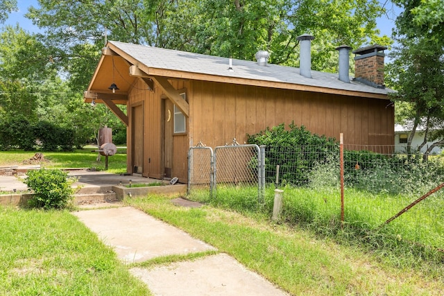 891 Lazy Acres Cir, Pottsboro, TX 75076 - view of home's exterior with a chimney