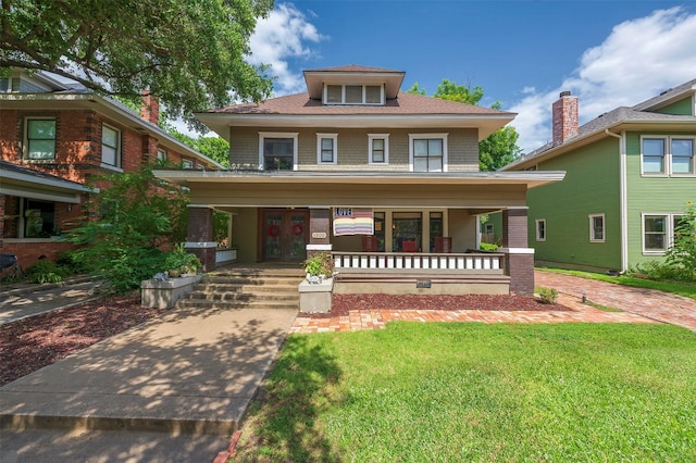 1909 Alston Ave, Fort Worth, TX 76110 - american foursquare style home with covered porch, a front yard, and french doors