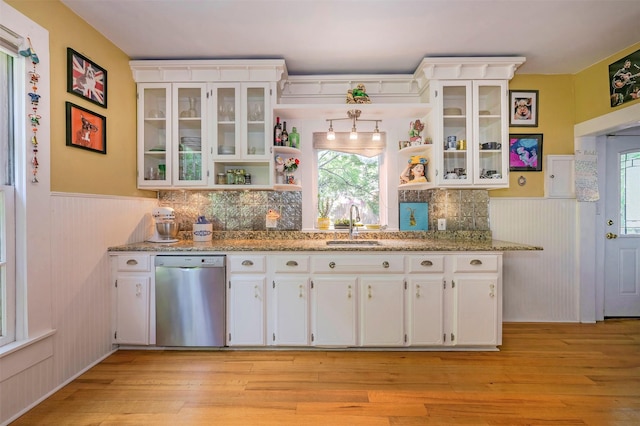 1909 Alston Ave, Fort Worth, TX 76110 - kitchen featuring dishwasher, open shelves, a wainscoted wall, a sink, and white cabinets