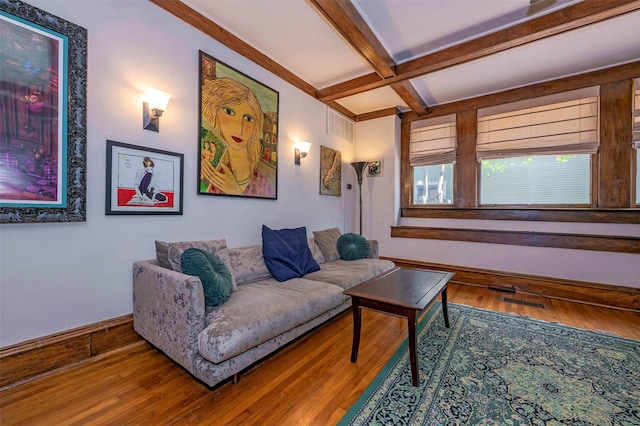1909 Alston Ave, Fort Worth, TX 76110 - living area with coffered ceiling, beamed ceiling, wood finished floors, and baseboards