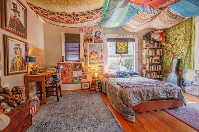 1909 Alston Ave, Fort Worth, TX 76110 - bedroom with wood finished floors