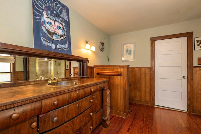 1909 Alston Ave, Fort Worth, TX 76110 - bathroom featuring wood finished floors, a wainscoted wall, vanity, and wood walls