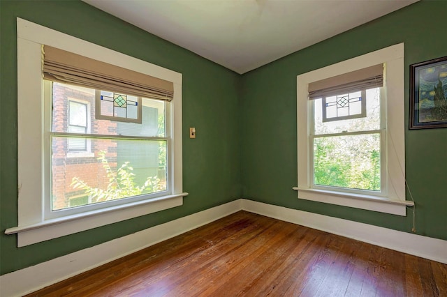 1909 Alston Ave, Fort Worth, TX 76110 - unfurnished room featuring dark wood-style floors and baseboards