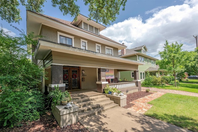 1909 Alston Ave, Fort Worth, TX 76110 - american foursquare style home with french doors, covered porch, and a front yard