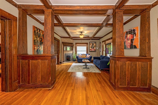 1909 Alston Ave, Fort Worth, TX 76110 - living room featuring coffered ceiling, hardwood / wood-style flooring, decorative columns, a ceiling fan, and beam ceiling