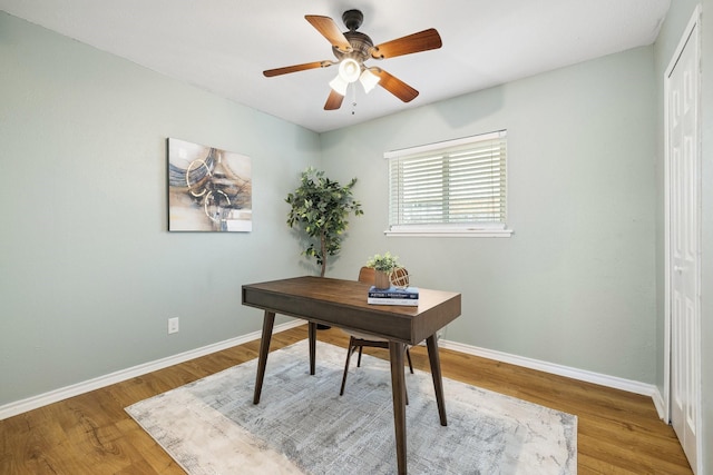 5044 Avery Ln, The Colony, TX 75056 - home office featuring baseboards, wood finished floors, and ceiling fan