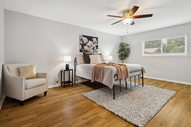 5044 Avery Ln, The Colony, TX 75056 - bedroom featuring baseboards, wood finished floors, and ceiling fan