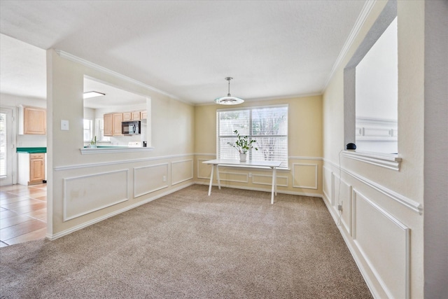 5144 Ivycrest Trl, Arlington, TX 76017 - unfurnished dining area with crown molding, a decorative wall, light colored carpet, and wainscoting