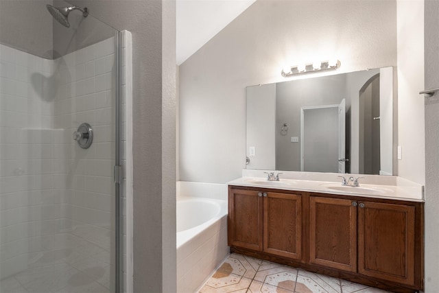 648 Tabasco Trl, Arlington, TX 76002 - full bathroom featuring a bath, a shower stall, double vanity, lofted ceiling, and tile patterned flooring