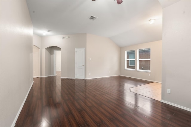648 Tabasco Trl, Arlington, TX 76002 - unfurnished room with arched walkways, wood finished floors, a ceiling fan, baseboards, and lofted ceiling