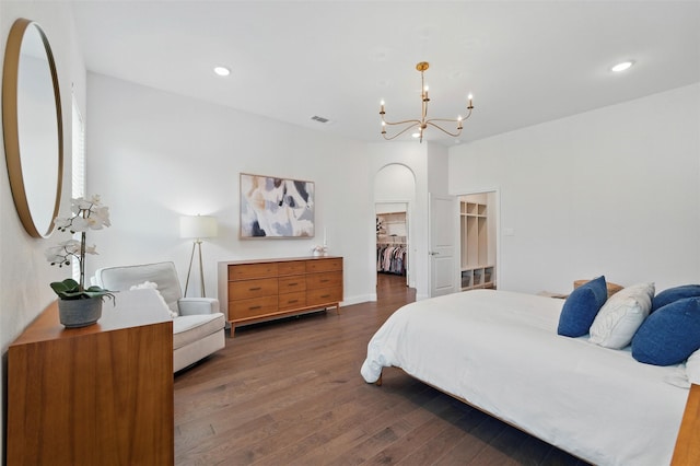 506 Prairie Run, Aledo, TX 76008 - bedroom featuring a walk in closet, wood finished floors, arched walkways, a chandelier, and recessed lighting