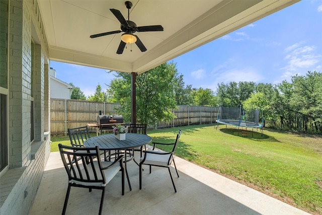 506 Prairie Run, Aledo, TX 76008 - view of patio / terrace with outdoor dining space, a trampoline, a ceiling fan, and area for grilling