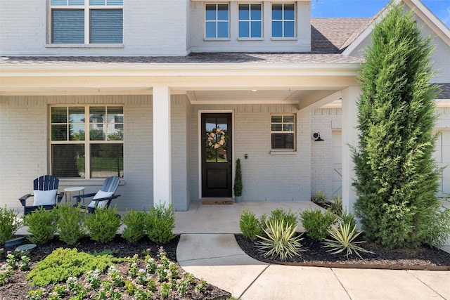 506 Prairie Run, Aledo, TX 76008 - doorway to property featuring a porch, brick siding, and roof with shingles