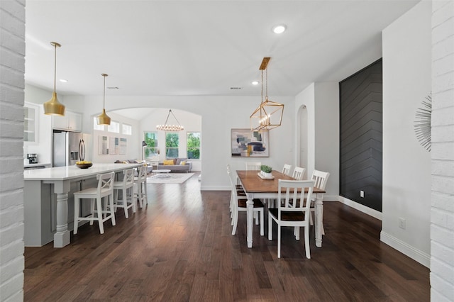 506 Prairie Run, Aledo, TX 76008 - dining room with arched walkways, dark wood finished floors, baseboards, a chandelier, and recessed lighting