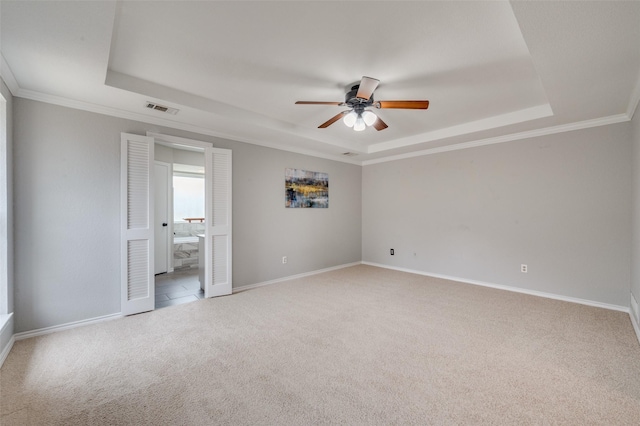 4704 N Meadow Ridge Cir, Mckinney, TX 75072 - unfurnished bedroom featuring a raised ceiling, carpet floors, baseboards, connected bathroom, and ornamental molding