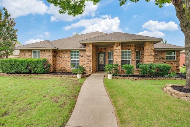 4704 N Meadow Ridge Cir, Mckinney, TX 75072 - view of front of property featuring a front lawn, brick siding, and roof with shingles