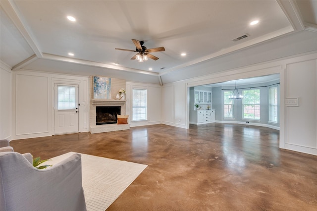 4704 N Meadow Ridge Cir, Mckinney, TX 75072 - unfurnished living room with a brick fireplace, ceiling fan, a chandelier, concrete floors, and a decorative wall