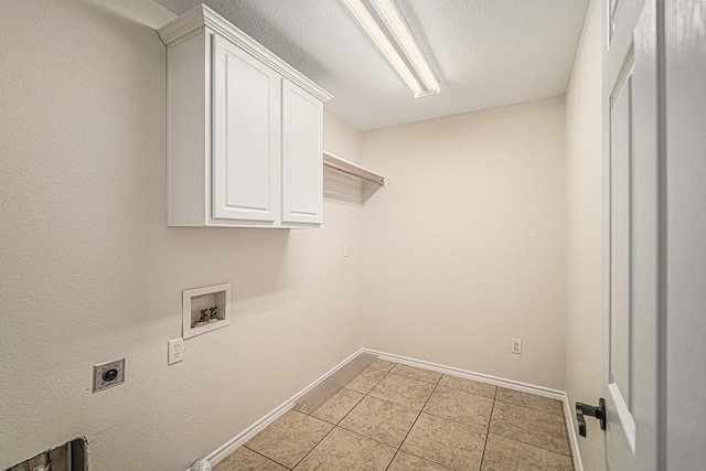 5516 La Bandera Trl, Benbrook, TX 76126 - laundry area featuring hookup for an electric dryer, hookup for a washing machine, cabinet space, and baseboards